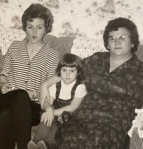 black and white photo of unhappy looking mom, grandma, daughter
