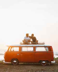 friends on a VW bus roof